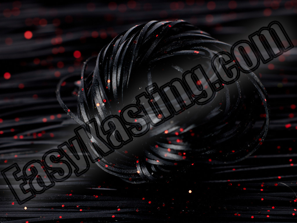 Black Silicone Skirt Tabs with Red Flake Rolled Into a Ball